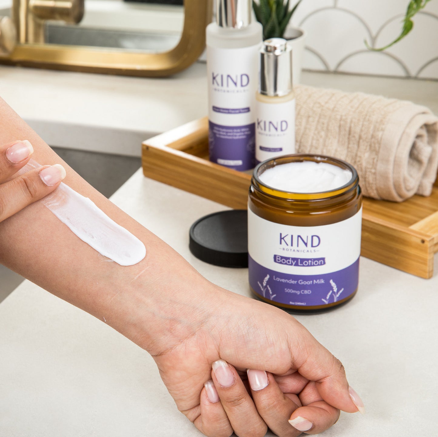 Kind Botanicals 500mg hemp goat milk lotion being applied on the arm
