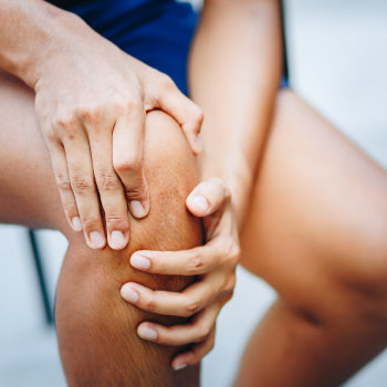 Person holding knee