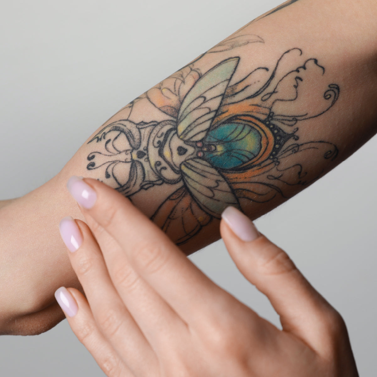 Tattoo Balm Being applied to skin with tattoo