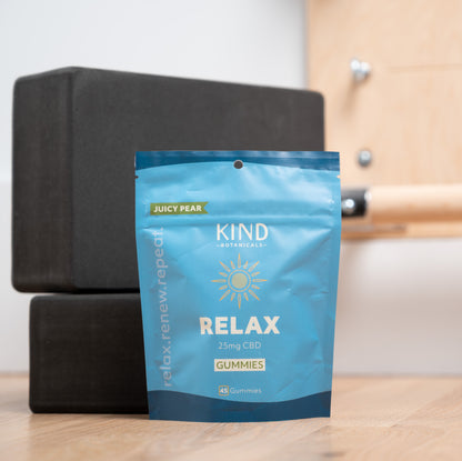 Kind relax gummies in studio with yoga blocks