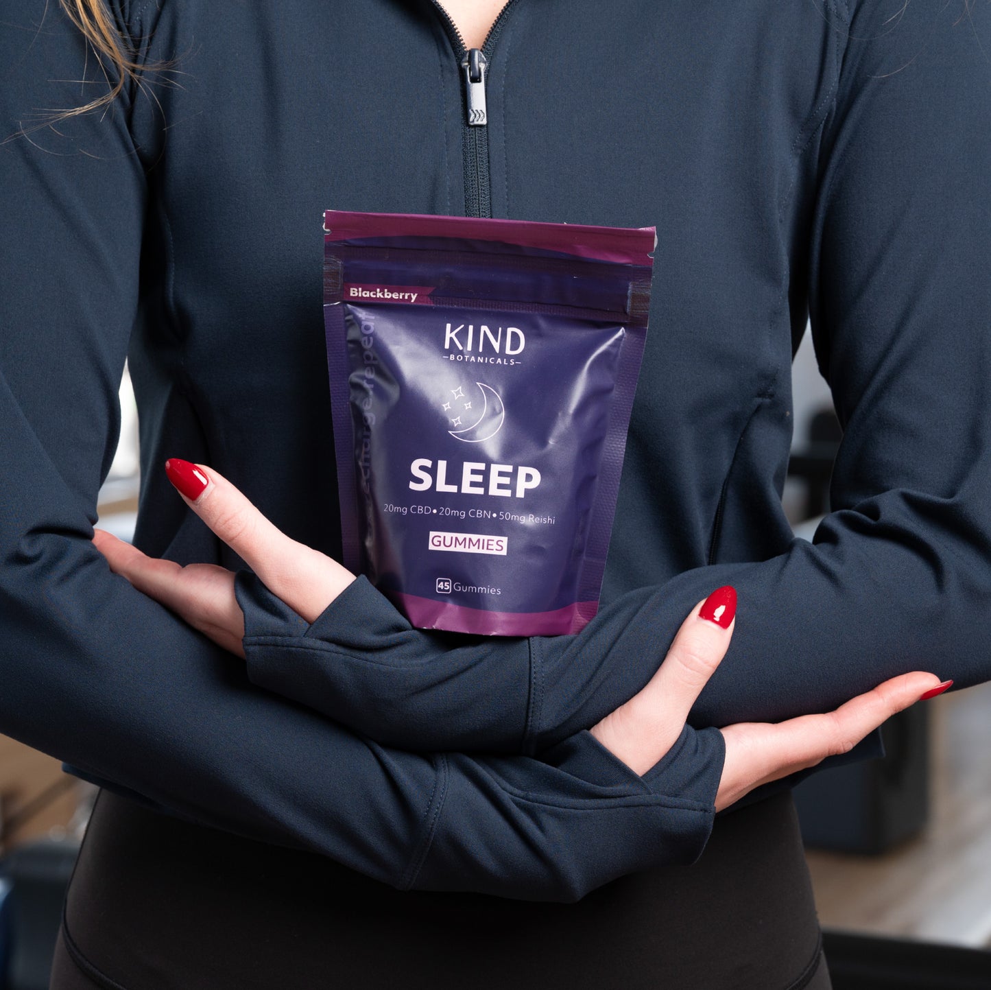 Women holding KIND Botanicals CBD Sleep Gummies