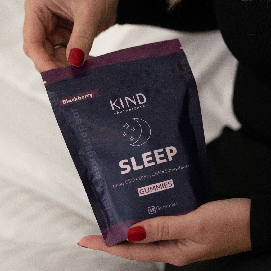 Kind Sleep gummies in a women's hand