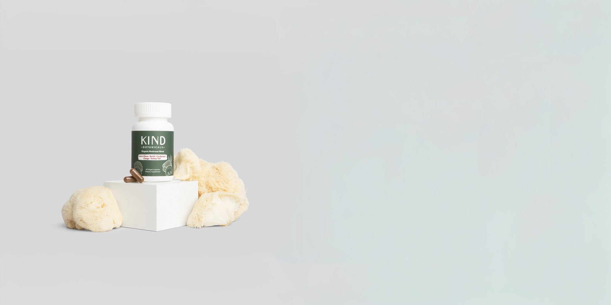KIND Mushroom Capsules on shite background 