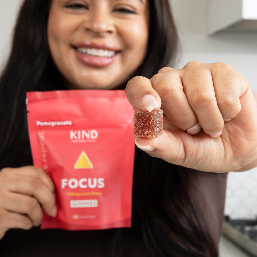 women holding a KIND Focus Lions Mane Gummy