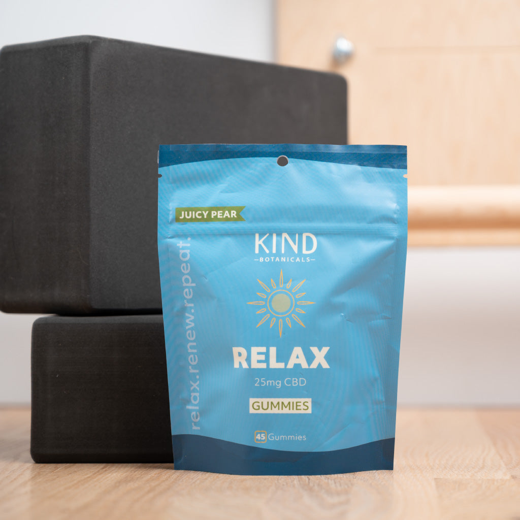 KIND Botanicals Relax Gummies in a yoga studio 